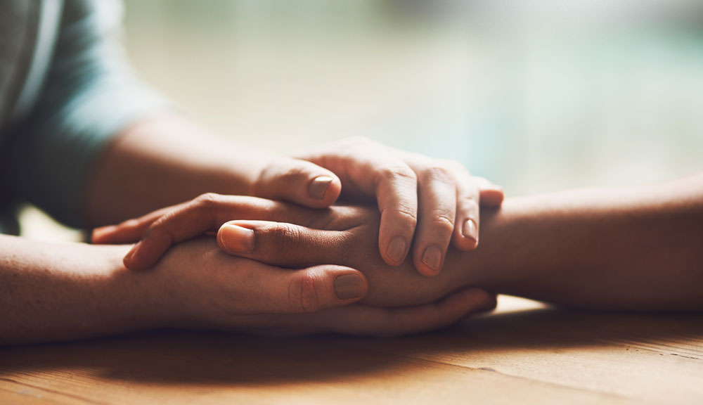 Umschlungene, sich haltende Hände